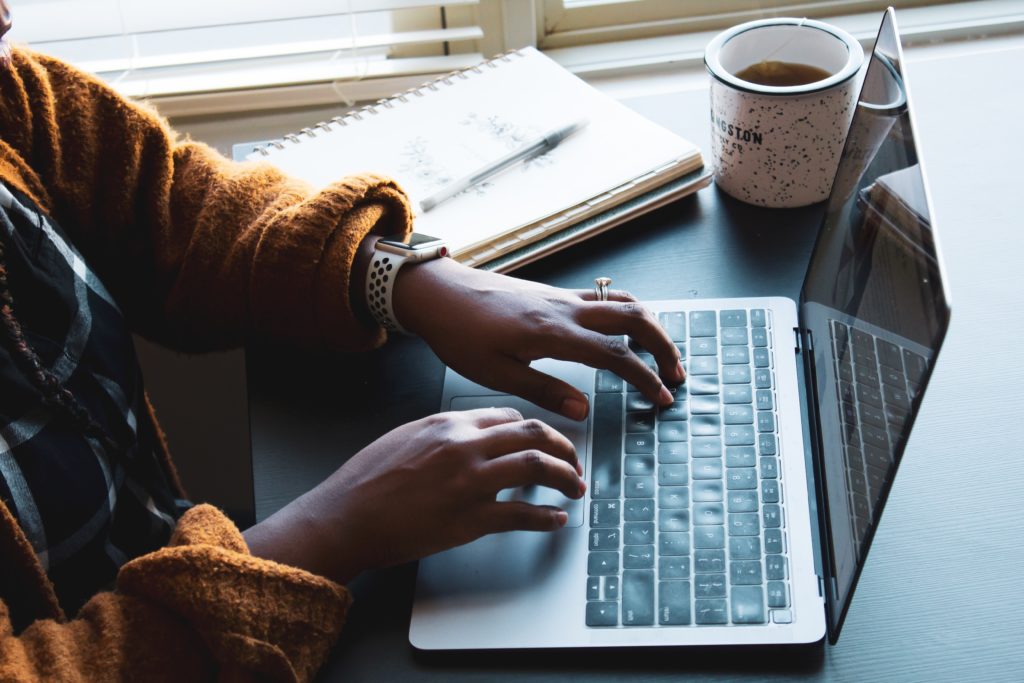 typing hands on laptop- content marketing